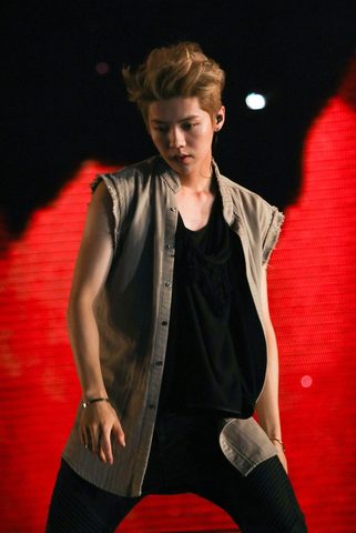 Lu Han performing on stage in 2014